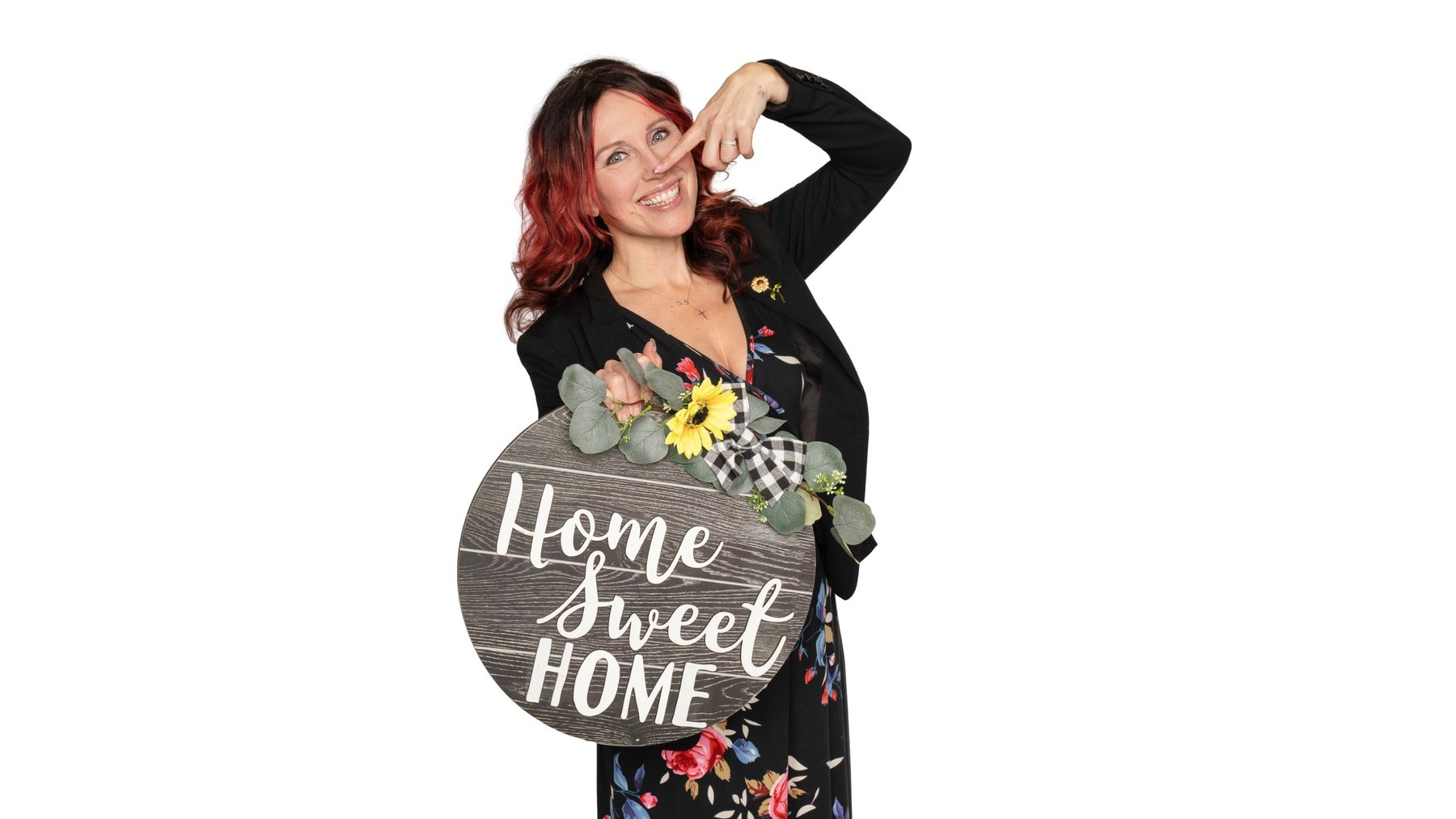 Krystal Lee Moore, London Ontario realtor with Royal LePage Triland, holding a Home Sweet Home sign